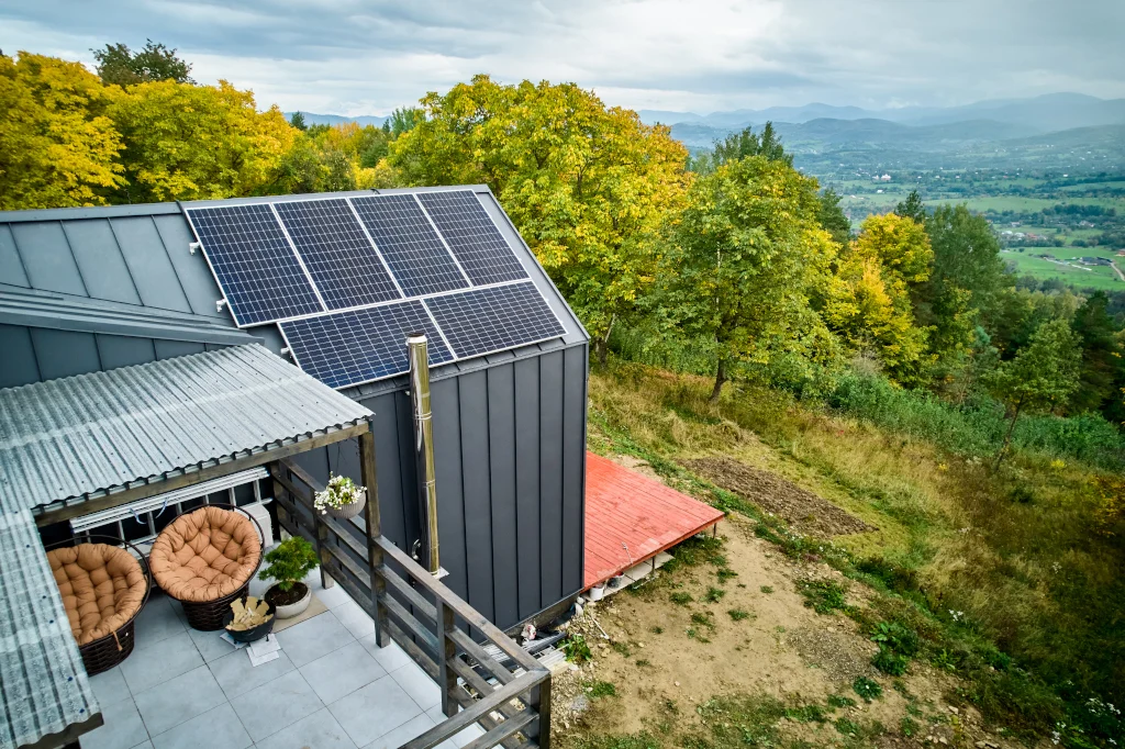 new-modern-house-cottage-with-solar-photovoltaic-panel-system-on-roof-aerial-view