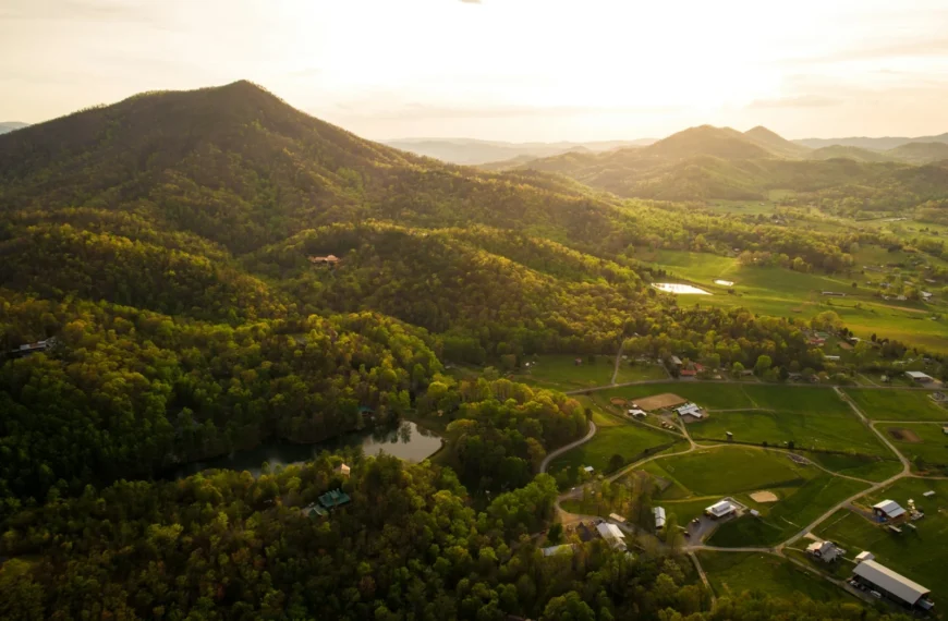 Aerial view of farmland in a green Tennessee mountain valley at sunset