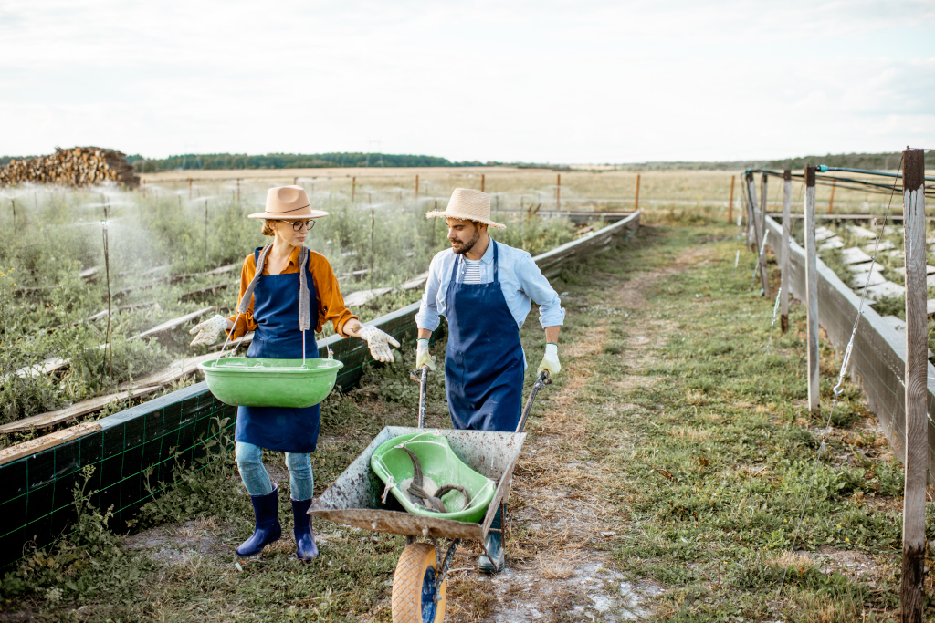 two-workers-on-the-farmland-outdoors