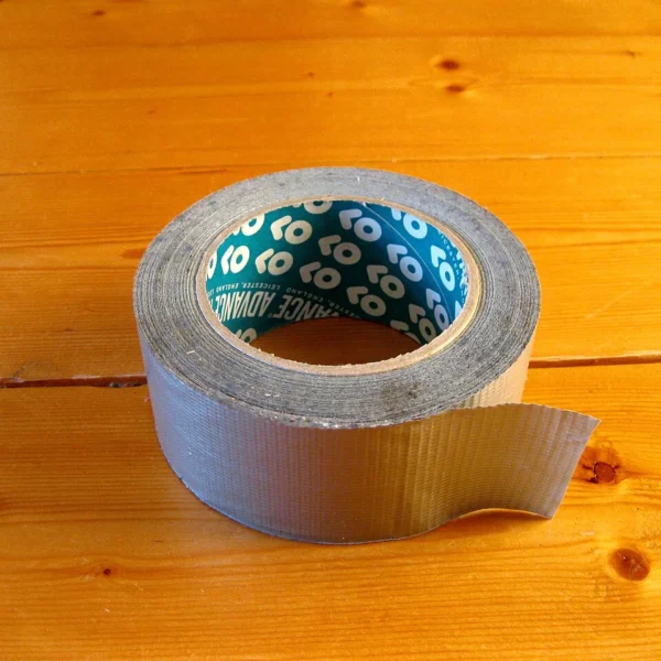 Emergency items that hold value: a roll of duct tape on a wooden table